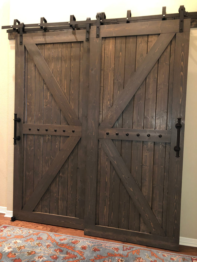 British Brace Bypass Barn Door Package showcased with a blue rug