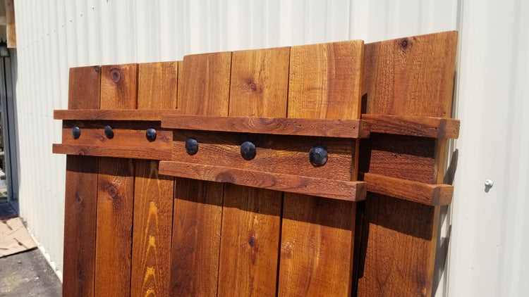 Close-up of iron clavos on a cedar wood shutter