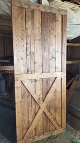 Full view of the Custom Bottom Brace Interior Barn Door with cross design