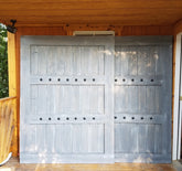 Custom wooden sliding shutter with a matching frame