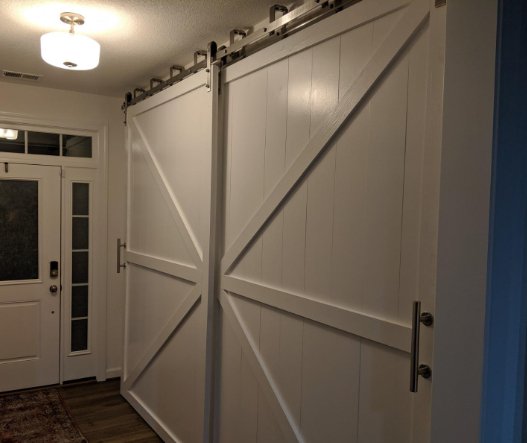 British Brace Bypass Barn Door Package featuring two doors and a light fixture