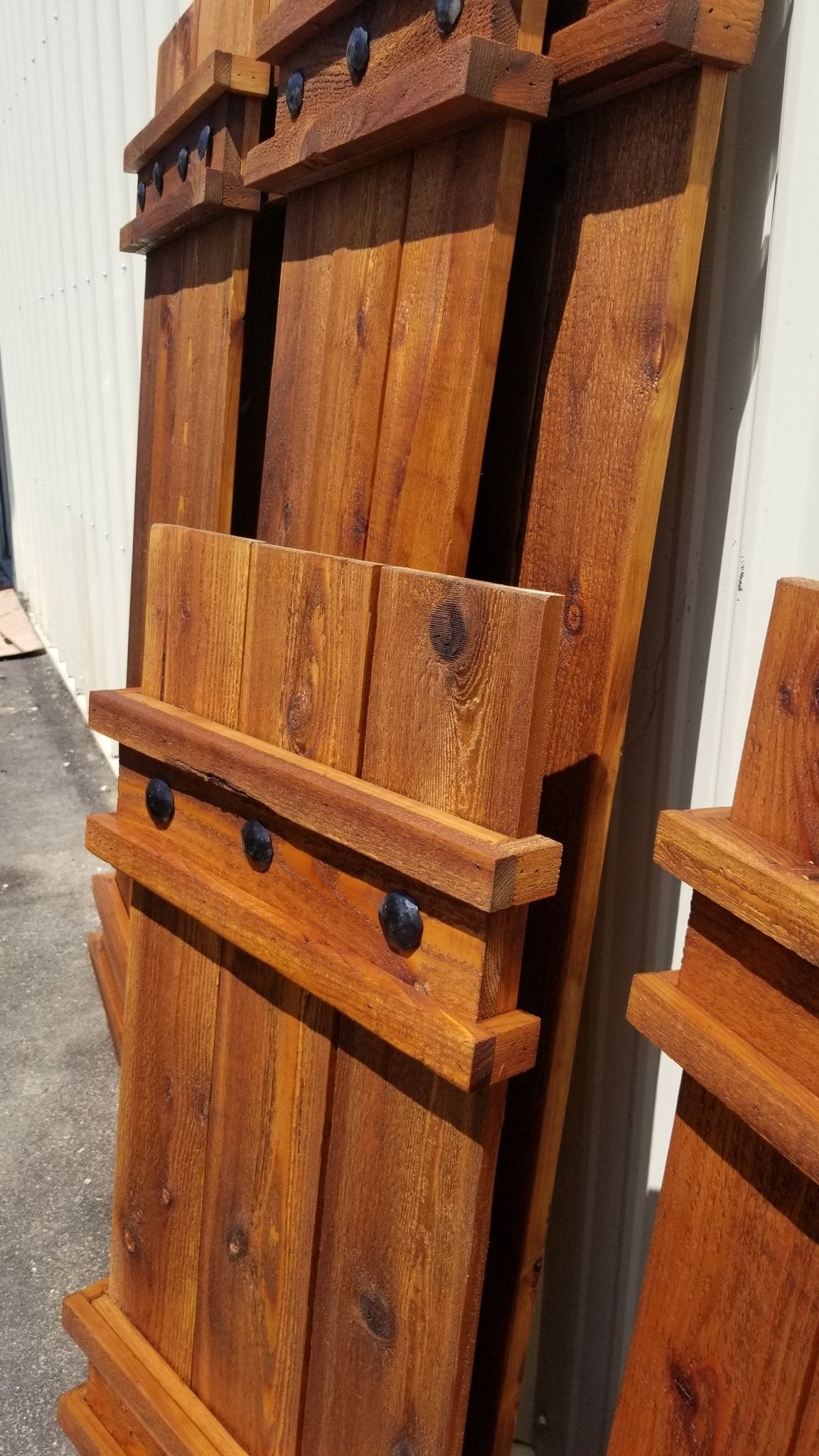Customized cedar wood shutters with attached hardware
