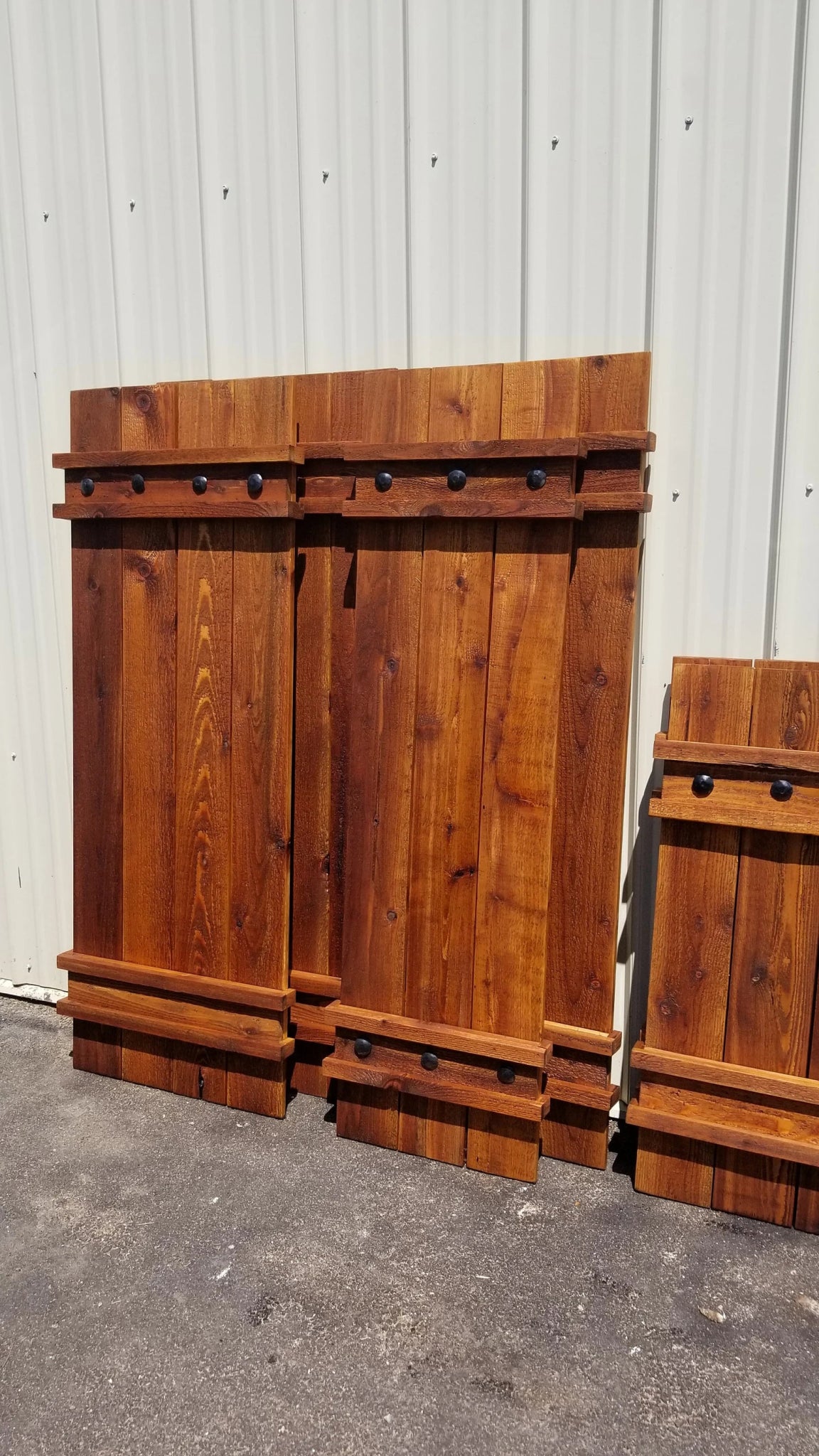 Three cedar wood shutters with handles and hinges