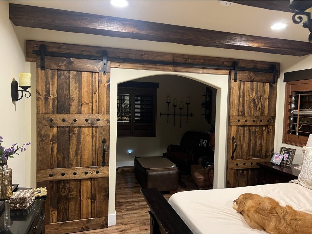 Bedroom interior with a bed and the Custom Double Horizon Barn Door