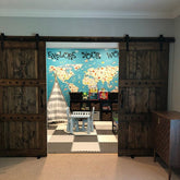 Room featuring the Custom Double Horizon Barn Door with a map on the wall