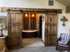 Bathroom interior with a Custom Double Horizon Barn Door and a bathtub