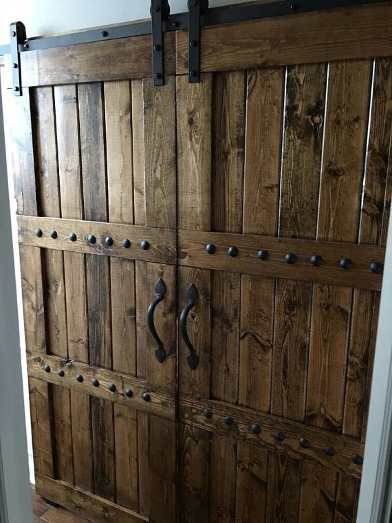 Double wooden sliding barn doors with metal handles from Custom Double Horizon Barn Door Package