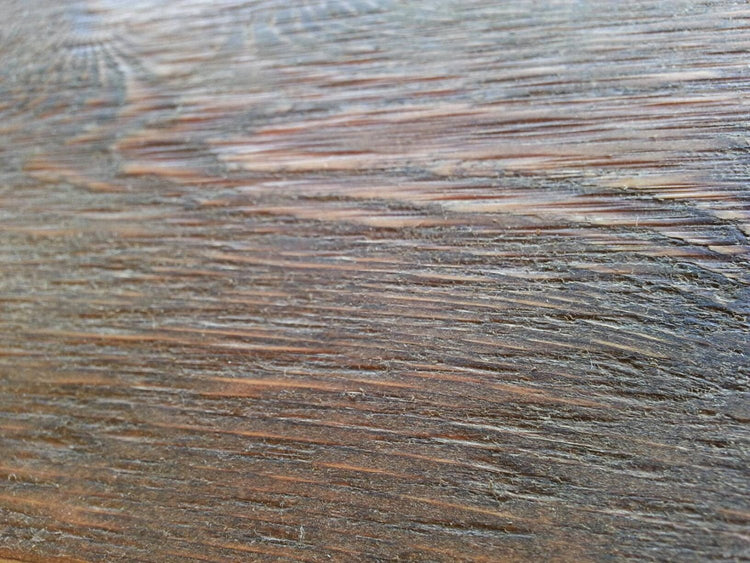 Close-up of rustic cedar wood surface showing natural scratches