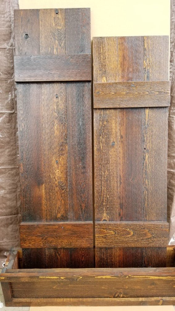 Double doors with rustic cedar shutters and wooden panels