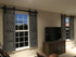 Living room showcasing custom sliding barn shutters on windows