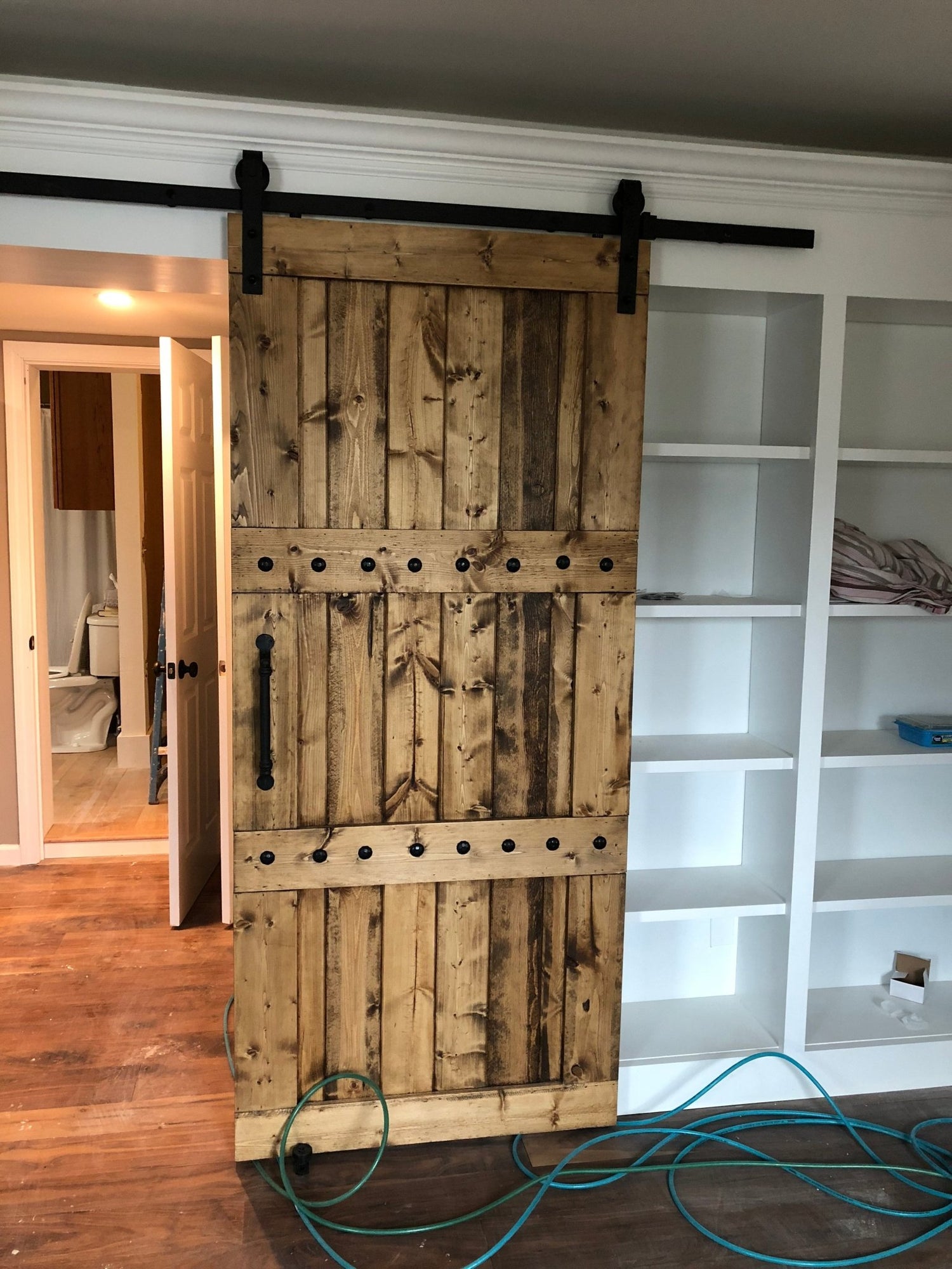 Room with a bookcase and Rustic 84x33 Paneled Style Interior Barn Door