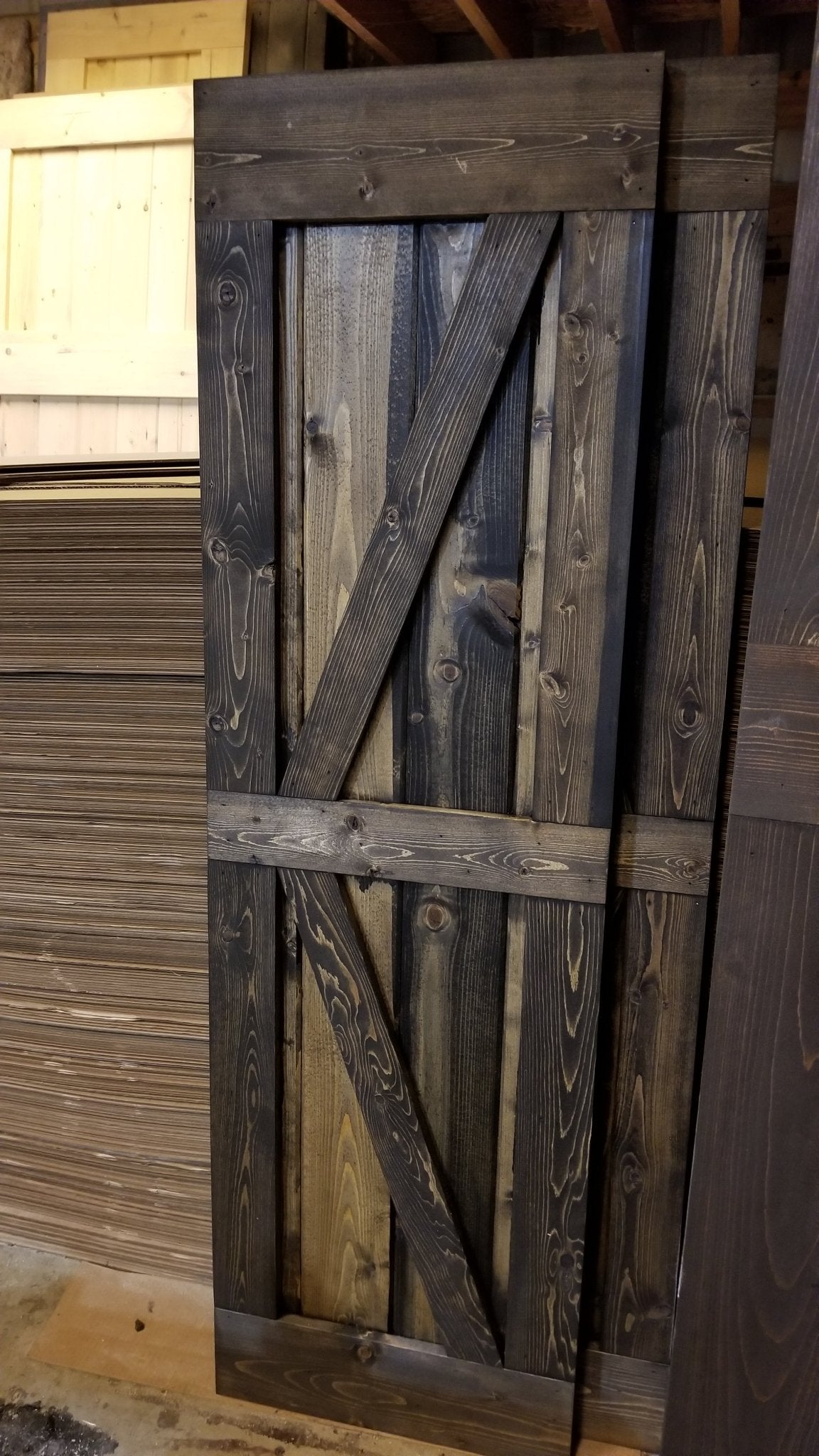 Dark brown Detail of the wooden frame and door of the TV Barn Door Package